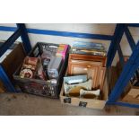 A box containing picture frames and albums, an Emm