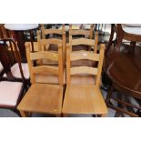 A set of six modern beech ladder back chairs