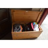A pine storage box and contents of dressing up clo