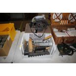 A circular saw; and a box of various tools to incl