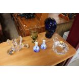 A collection of glassware to include vases; and a