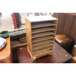 A pine table top storage shelf