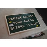 A cast metal sign