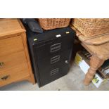 A metal three drawer filing chest