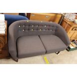 A button back upholstered settee