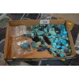 A box of polished turquoise and other stones