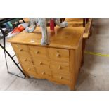 A small pine chest fitted three long drawers