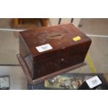 A 19th Century mahogany money box, and contents of