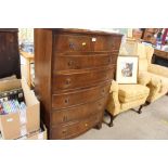 A reproduction mahogany bow front chest, fitted wi