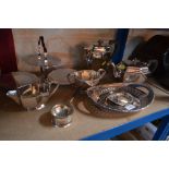 A silver plated cake basket; a four piece tea set,