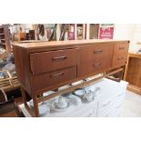 A teak sideboard fitted six drawers