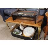 An oak coffee table raised on gilt supports