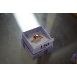 A boxed silver gilt and red stone set ring