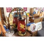 A large pottery vase AF; and two umbrellas