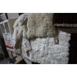 An approx. 3'3" x 2' lamb skin rug; and an approx.