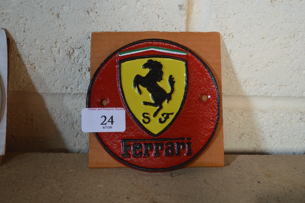 A reproduction cast iron Ferrari advertising sign