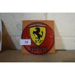 A reproduction cast iron Ferrari advertising sign