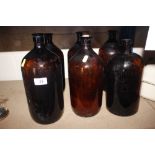 Six vintage chemist bottles