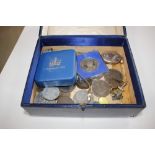 A blue leather box containing various coinage; a l