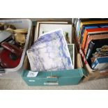 A box of various pictures and prints