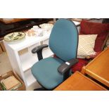 An upholstered swivel office chair