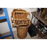 Two wicker baskets; and a bamboo magazine rack