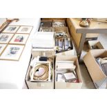 Eight boxes containing various picture frames and