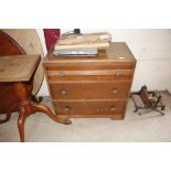 An oak veneered three drawer chest