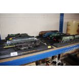 Ten various model trains on stands