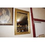 A gilt framed bevel edged wall mirror