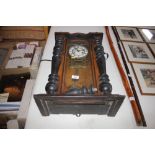 A Victorian walnut and ebonised cased wall clock