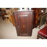 A George III oak hanging cupboard