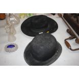 A bowler hat and one other hat