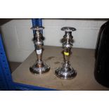 A pair of plated candlesticks