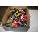 A box of various Diecast model planes and vehicles