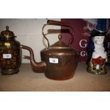 An antique copper kettle