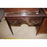 A 19th Century carved mahogany low boy fitted thre