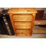 A pine open fronted bookcase