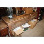 An 18th Century oak dresser base fitted three draw