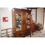 A late Victorian double wardrobe fitted four drawe