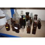 Six vintage chemist bottles of varying sizes
