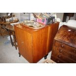 A pair of teak two door cabinets