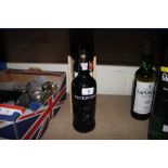 A boxed bottle of Warre's Vintage port; and a bott