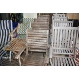 A set of four teak garden chairs