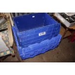 A quantity of plastic storage crates