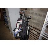 Two golf bags and contents to include Ping, TaylorMade etc.