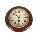 A late 19th Century oak cased circular wall clock, the painted dial inscribed "K.R. Ingram,
