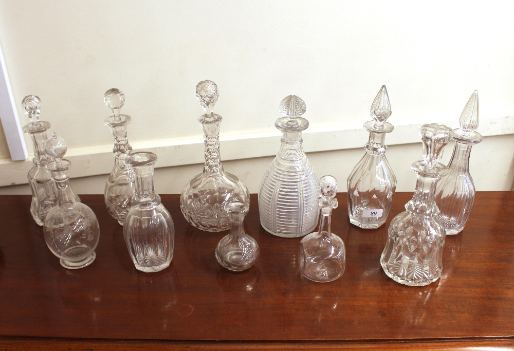 A collection of various Antique glass decanters, some without stoppers