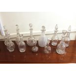 A collection of various Antique glass decanters, some without stoppers