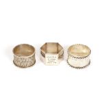 A collection of various silver and white metal napkin rings, including Eastern filigree work